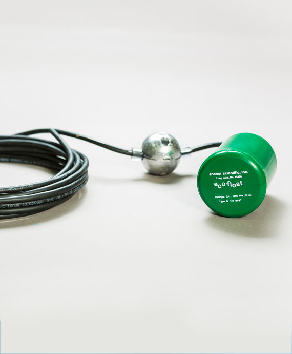 A green, cylindrical object known as "Eco-Float Green," functioning as a mercury-free level switch, is attached to a metal ball with a black cable. This innovative liquid level control system is showcased against a light gray background.